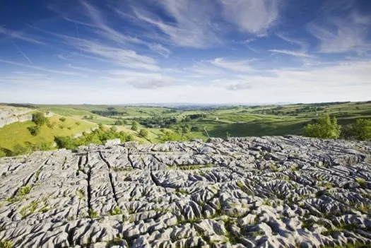 CLIMBING AND CAVING AT MALHAM COVE IN THE YORKSHIRE DALES, ENGLAND