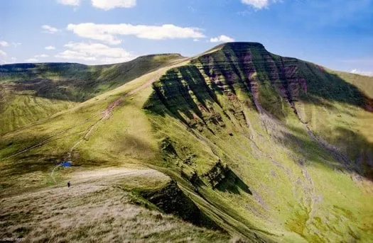 REACHING THE SUMMIT OF PEN Y FAN IN THE BRECON BEACONS NATIONAL PARK, WALES